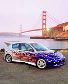 AUT 35 RK0392 01
2002 Ford Focus FR200 Turbo Silver With Graphics 3/4 Side View On Pavement By Golden Gate Bridge
