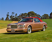 AUT 35 RK0399 01
2002 Rolls-Royce Corniche Convertible Bronze 3/4 Front View On Grass