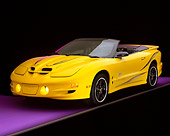 AUT 35 RK0065 02
2002 Pontiac Firebird Trans Am Convertible Yellow 3/4 Front View On Purple Floor Gray Line Studio