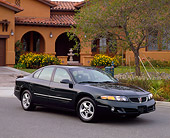 AUT 35 RK0077 08
2002 Pontiac Bonneville SE Green 3/4 Front View On Pavement By House