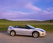 AUT 35 RK0084 02
2002 Mitsubishi Eclipse Spyder GT Silver 3/4 Side View On Pavement By Grass Hills