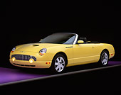 AUT 35 RK0109 04
2002 Ford Thunderbird Convertible Yellow 3/4 Front View On Purple Floor Gray Line Studio