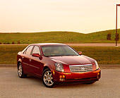 AUT 35 RK0117 02
2002 Cadillac CTS Burgundy Front 3/4 View On Pavement By Grass Hills Filtered