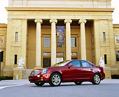 AUT 35 RK0121 03
2002 Cadillac CTS Burgundy Low 3/4 Side View On Pavement By Building