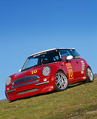 AUT 35 RK0133 17
2002 Mini Mania Mini Cooper Red Slanted 3/4 Front View On Grass Hill