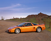 AUT 35 RK0149 02
2002 Acura NSX Imola Orange 3/4 Front View On Dirt Blue Sky