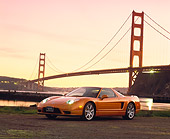 AUT 35 RK0156 02
2002 Acura NSX Imola Orange Pearl 3/4 Front View On Dirt SF Bridge At Dusk