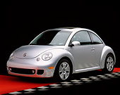 AUT 35 RK0161 03
2002 Volkswagen New Beetle Turbo S Silver 3/4 Front View On Red Floor Checkered Line Studio