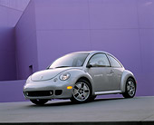 AUT 35 RK0173 04
2002 Volkswagen New Beetle Turbo S Silver Slanted 3/4 Front View On Pavement Against Purple Wall