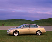 AUT 35 RK0188 01
2002 Nissan Altima Champagne 3/4 Front View On Grass Cloudy