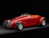 AUT 35 RK0192 06
2002 Torpedo Roadster Custom Red 3/4 Side View On Gray Floor Studio