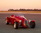 AUT 35 RK0207 06
2002 Torpedo Roadster Custom Red 3/4 Front View On Pavement Filtered