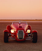 AUT 35 RK0209 04
2002 Torpedo Roadster Custom Red Head On Shot On Pavement Filtered