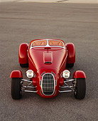 AUT 35 RK0210 02
2002 Torpedo Roadster Custom Red Head On Shot On Pavement