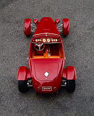 AUT 35 RK0212 05
2002 Torpedo Roadster Custom Red Overhead Rear View On Pavement