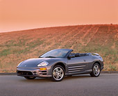 AUT 35 RK0223 02
2002 Mitsubishi Eclipse GTS Spyder Gray 3/4 Front View On Pavement By Grass Hill Filtered
