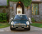 AUT 35 RK0233 01
2002 Mini Cooper Green White Top Head On Shot In Front Of House On Driveway