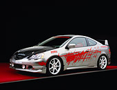 AUT 35 RK0315 02
2002 Acura RSX Nitrous Gray Red Graphics Suspension Techniques 3/4 Front View On Red Floor Gray Line Studio
