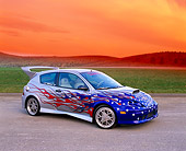 AUT 35 RK0327 04
2002 Ford Focus FR200 Turbo Silver Patriotic Graphics Modify By APC 3/4 Side On Gravel Filtered In Fast & Furious 2