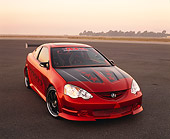 AUT 35 RK0336 03
2002 Acura RSX Type S Red With Graphics Modify By APC Front 3/4 View On Pavement At Dusk