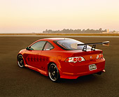 AUT 35 RK0341 02
2002 Acura RSX Type S Red With Graphics Modify By APC Rear 3/4 View On Pavement At Dusk