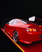 AUT 35 RK0343 12
2002 Acura RSX Type S Red With Graphics Modify By APC Wide Angle 3/4 Rear Side View On Red Floor Studio