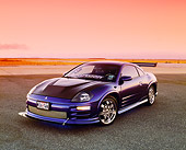 AUT 35 RK0380 01
2002 Mitsubishi Eclipse Violet Blue 3/4 Front View On Pavement Filtered