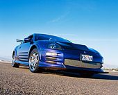 AUT 35 RK0386 01
2002 Mitsubishi Eclipse Violet Blue Low 3/4 Front View On Pavement Blue Sky
