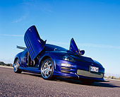 AUT 35 RK0388 01
2002 Mitsubishi Eclipse Violet Blue Low 3/4 Front View Doors Open On Pavement
