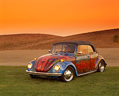 AUT 36 RK0044 04
1972 VW Bug Art Car 3/4 Front View On Grass Hills Yellow Sky