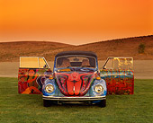 AUT 36 RK0046 01
1972 VW Bug Art Car Head On Shot Doors Open On Grass Hills Red Sky