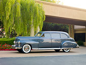 AUT 37 RK0032 01
1949 Cadillac 75 Imperial Limousine Gray 3/4 Front View On Pavement By Trees And Building