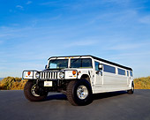 AUT 37 RK0010 15
2000 Hummer H1 Limousine White 3/4 Front View On Pavement Blue Sky