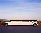 AUT 37 RK0013 02
2000 Hummer Stretched Limousine White 22 Pax Side View On Pavement Blue Sky
