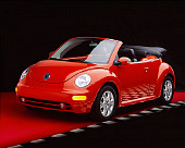 AUT 38 RK0141 06
2003 VW New Beetle Convertible Sundown Orange 3/4 Front View Studio