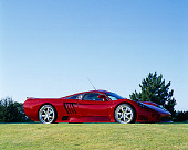 AUT 38 RK0190 02
2003 Saleen S7 Red 3/4 Front View On Grass Blue Sky