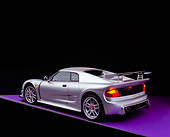 AUT 38 RK0244 10
2003 GSR Noble M12 GTO Silver 3/4 Rear View On Purple Floor Studio