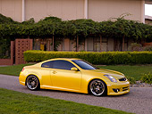 AUT 38 RK1893 01
2003 Infiniti G35 Yellow   Side 3/4 View On Pavement By Trees And Bushes