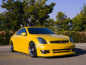 AUT 38 RK1894 01
2003 Infiniti G35 Yellow Low 3/4 Front View On Pavement By Trees