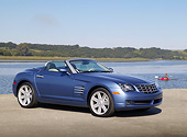 AUT 39 RK0329 01
2004 Chrysler Crossfire Convertible Blue 3/4 Side View On Pavement By Water