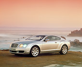 AUT 39 RK0097 02
2004 Bentley Continental GT Silver 3/4 Side View On Sand By Ocean Filtered