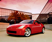 AUT 39 RK0139 05
2004 Nissan 350Z Track Red  Low 3/4 Front View On Pavement By Building Filtered