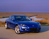 AUT 39 RK0064 06
2004 Mazda RX-8 Blue 3/4 Front View On Pavement By Marsh Purple Sky