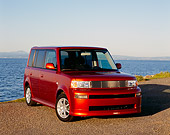 AUT 39 RK0195 02
2004 Toyota Scion XB Orange Front 3/4 View On Pavement By Water