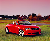 AUT 39 RK0254 02
2004 Audi TT Roadster Quattro Red 3/4 Front View On Grass By Trees Filtered