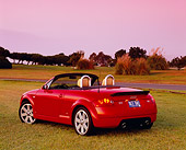 AUT 39 RK0257 01
2004 Audi TT Roadster quattro Red 3/4 Rear View On Grass By Trees Filtered