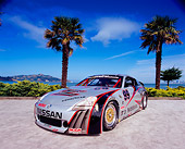 AUT 39 RK0268 03
2004 Nissan 350Z GT3 Race Car 3/4 Front View By Palm Trees Blue Sky