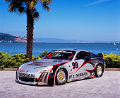 AUT 39 RK0273 01
2004 Nissan 350Z GT3 Race Car Silver 3/4 Front View By Water And Palm Tree