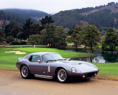 AUT 39 RK0294 02
2004 Superformance Brock Coupe Gray 3/4 Front View On Road By Lake