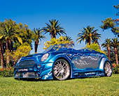 AUT 39 RK0309 03
2004 Alpine Mini Cooper Custom Paint Low 3/4 Side View On Grass By Trees